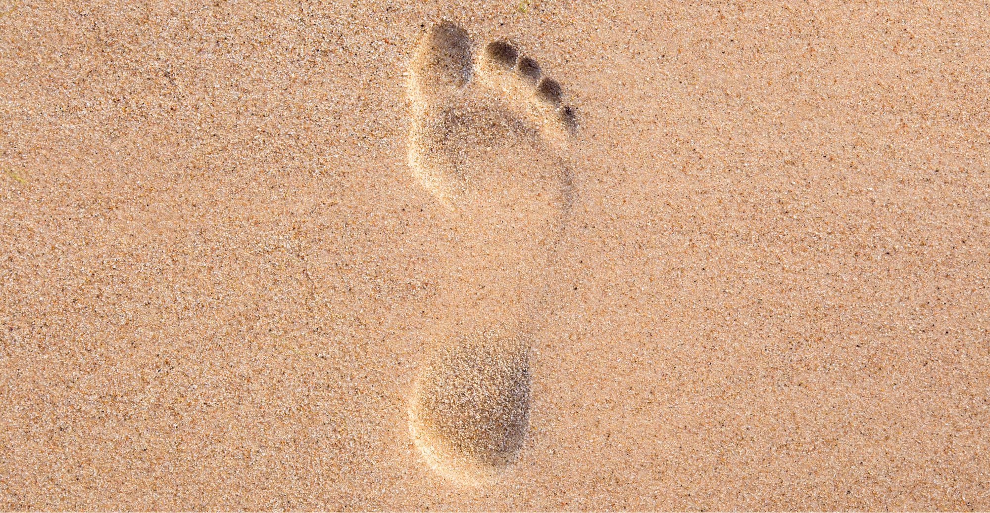 Empreinte de pied sur le sable